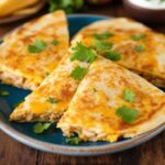 easy cheesy chicken quesadillas cooked until golden and crispy on a plate
