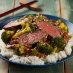 beef and broccoli stir fry cooked in a skillet with tender beef and fresh broccoli